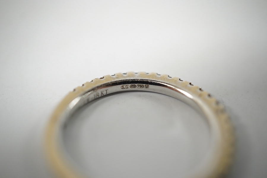 A modern Vera Wang 18ct white gold and diamond chip set half eternity ring, size K, gross weight 2.6 grams. Condition - good